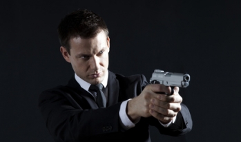 FBI agent with his gun drawn and pointed FBI agent with his gun drawn and pointed