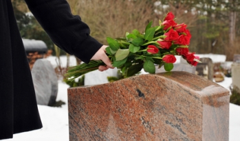 flowers placed on a headstone flowers placed on a headstone