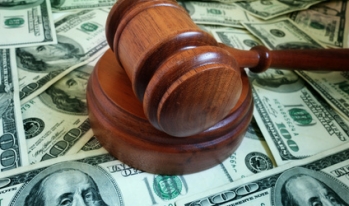 gavel on hundred dollar bills gavel on hundred dollar bills
