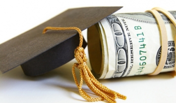 Graduation cap and money roll Graduation cap and money roll