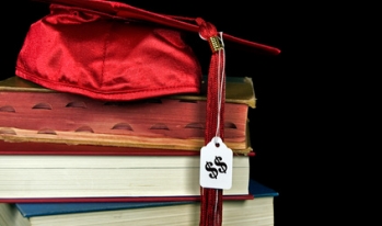 Graduation cap on textbooks Graduation cap on textbooks