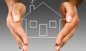 hands covering a home hands covering a home