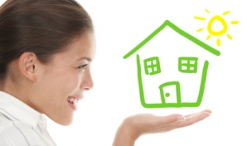 Happy woman holding home Happy woman holding home