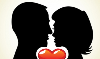 Couple about to kiss over a heart Couple about to kiss over a heart