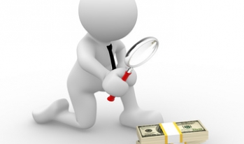 Man with magnifying glass looking at money Man with magnifying glass looking at money