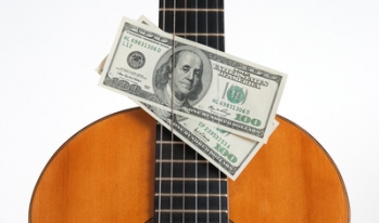 hundred dollar bills behind guitar strings hundred dollar bills behind guitar strings