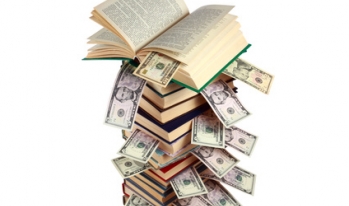 Text books filled with student loan debt Text books filled with student loan debt