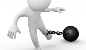 Man with ball and chain around ankle Man with ball and chain around ankle
