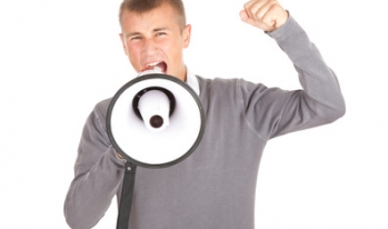 young student yelling through loudspeaker young student yelling through loudspeaker